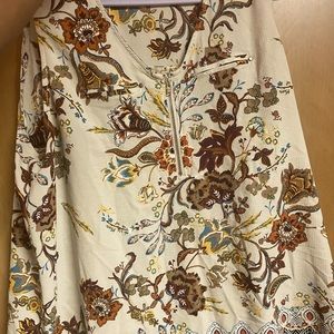 Dressy tank top with a zipper down the middle. Cute to wear for any occasion.